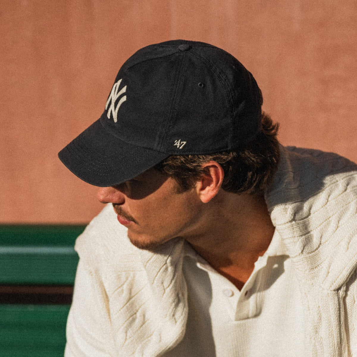 Man wearing a New York Yankees '47 navy cap.
