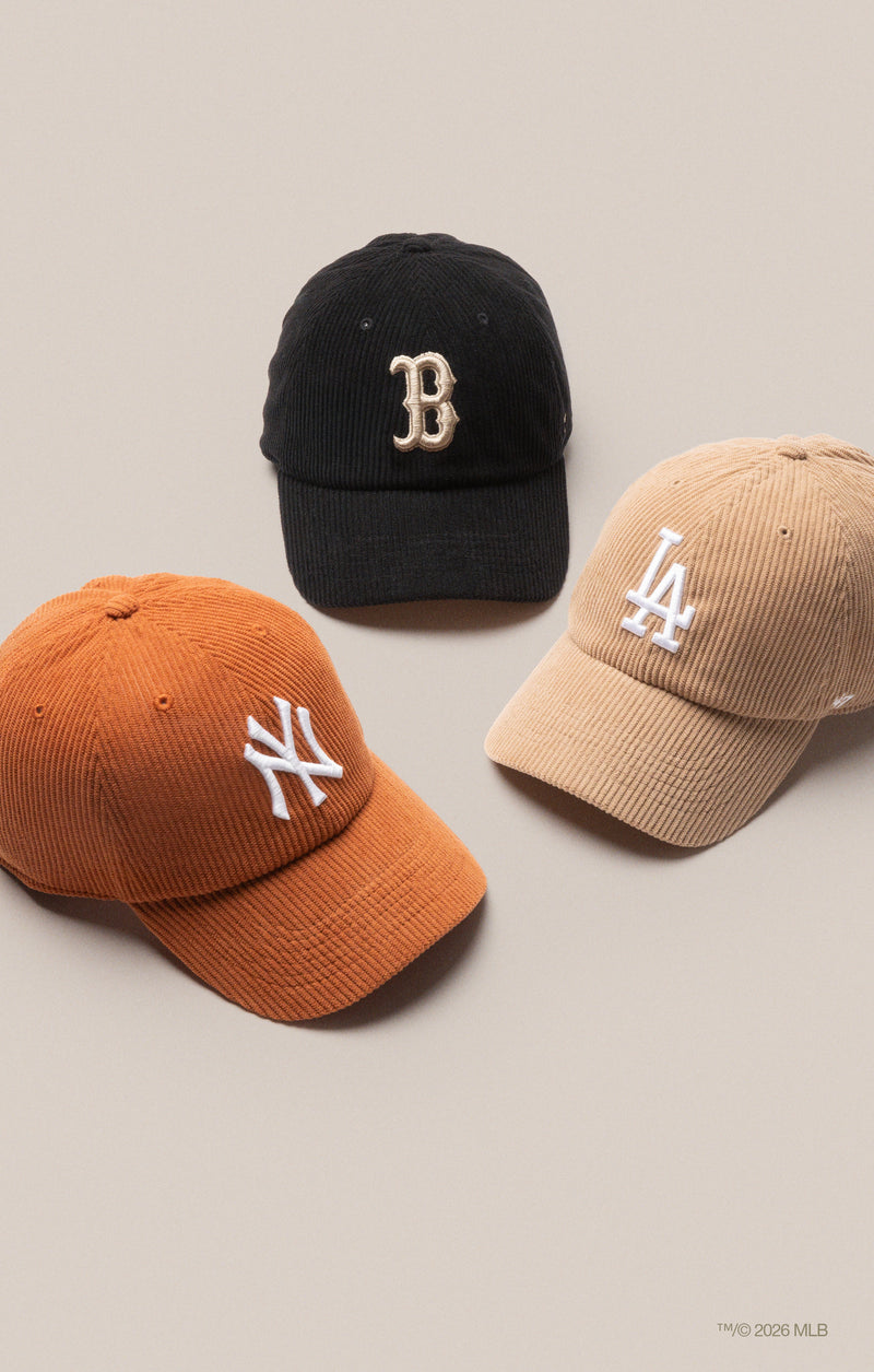 A  black Boston Red Sox hat, brown Los Angeles Dodgers hat and orange New York Yankees hat all in corduroy material