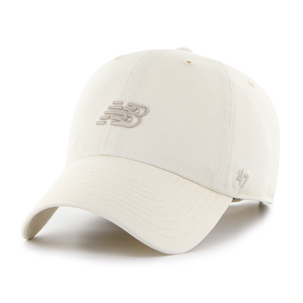 Pictured is this New Balance Core '47 CLEAN UP cap in cream. 1